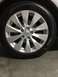 2014 Honda Accord - A close-up view of a silver Honda alloy wheel and tire, showing the vehicle's badge and tire details.