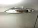 2014 Honda Accord - A close-up shot focuses on the chrome door handle of a vehicle, revealing a keyhole and a reflection.
