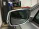 2014 Honda Accord - A close-up view of a car's side mirror, showing a reflection of the interior and a hand.
