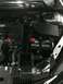 2014 Honda Accord - The engine bay of a vehicle, the battery and air intake system.