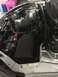 2014 Honda Accord - The engine bay of a silver Honda Accord, showing the engine, battery, and various components.