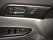 2014 Honda Accord - Close-up of a car's interior door panel, showing the door handle, window controls, and mirror adjustment buttons.