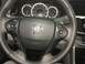 2014 Honda Accord - The interior of a 2014 Honda Accord features a leather-wrapped steering wheel with integrated controls and a clear instrument cluster.