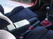 1993 Mazda MX-3 - Interior view of a car showing the front seats, center console, and gear shifter.