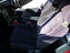 1993 Mazda MX-3 - Interior view showing front seats, dashboard, and gear shifter with a red boot.
