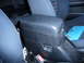 1993 Mazda MX-3 - Close-up of a car's center console and part of the seats, with a blue folder visible.