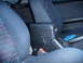 1993 Mazda MX-3 - The interior of a 1993 Mazda MX-3 features distinctive blue fabric seats with a geometric pattern.