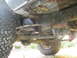 1979 Ford Bronco - The undercarriage of this 4x4 shows extensive rust on the frame and suspension components.