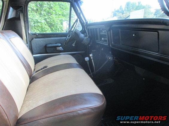 1979 Ford Bronco interior showing two-tone seats, dashboard, and steering wheel