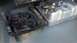 1995 Ford Bronco - A detached radiator fan shroud sits next to a silver fuel tank and hitch receiver.