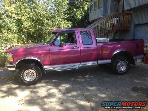 Purple 1992 Ford F-150 pickup truck, side view, with chrome accents and a toolbox in the bed