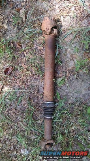 Rusty driveshaft with universal joints and a rubber boot