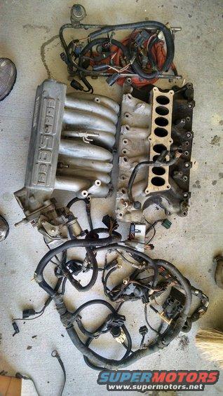 Engine intake manifold and wiring harness on concrete floor