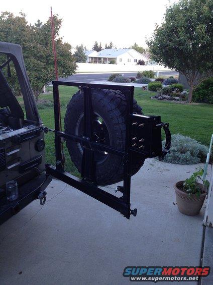 2005 Jeep Wrangler rear tire carrier mount with spare tire attached