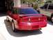 1995 Ford Probe - Rear view of a red 1995 Ford Probe, identified by its distinctive body style and 'Probe 24V' badging.