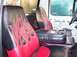 1990 Ford Bronco - Custom interior features flame-patterned seats and a center console with cup holders.