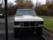 1990 Ford Bronco - This truck is missing its headlights and grille, making it difficult to identify the exact model or year.