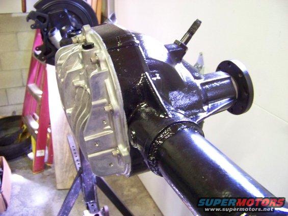 Rear differential assembly with brake caliper mounted, on a stand