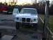 1990 Ford Bronco - This 1987 Ford Bronco is missing its grille and headlights, and has an aftermarket hood scoop.