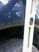 2006 Nissan Titan - A level and ruler are used to measure the height of a vehicle's tire and suspension components.