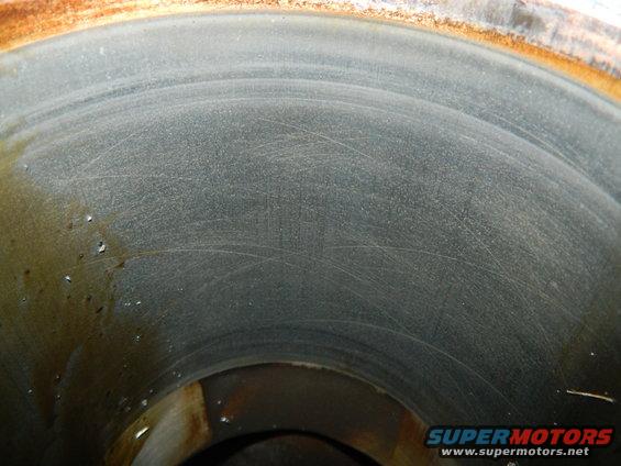 Cylinder wall with visible cross-hatching and oil residue