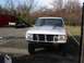 1990 Ford Bronco - Silver 1990 Ford Bronco parked outside, undergoing some work.