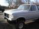 1990 Ford Bronco - This Ford Bronco appears to be from the early 1990s, but the custom hood suggests modifications beyond the original factory design.