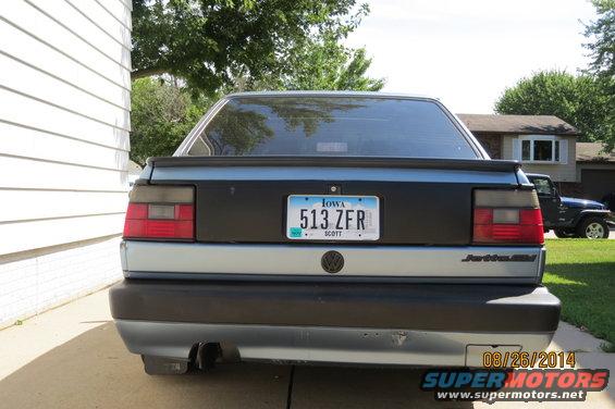 1990 Volkswagen Jetta rear with Iowa license plate 513 ZFR. Jeep visible in background