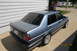 1990 Volkswagen Jetta - A blue 1990 Volkswagen Jetta is seen from a three-quarter front angle, parked next to a house.