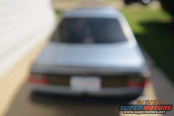Silver sedan's rear view, license plate blurred