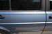 1990 Volkswagen Jetta - This vehicle has a pinstripe along the side and a reflection in the window.