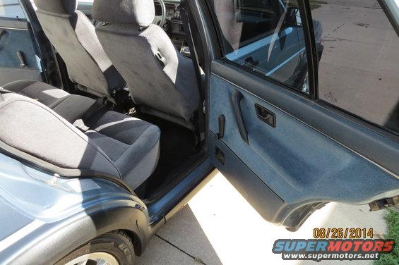 Interior of a car showing front and back seats, door panel, and steering wheel. Date stamp reads 08/26/2014