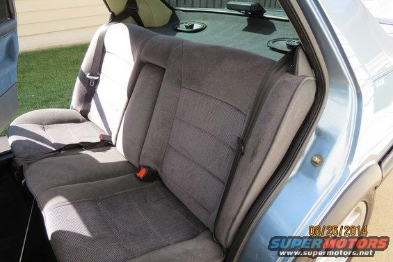 Rear seat and interior of a light blue car, showing fabric seats and seatbelts. Date stamp reads 08/26/2014