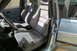 1990 Volkswagen Jetta - The interior of a car features grey fabric seats with red Recaro logos visible on the headrests.