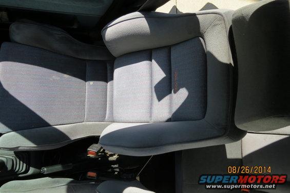 Gray fabric car seats with orange stitching detail