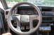 1990 Volkswagen Jetta - The interior of a Volkswagen is visible, showing the dashboard, steering wheel, and pedals.