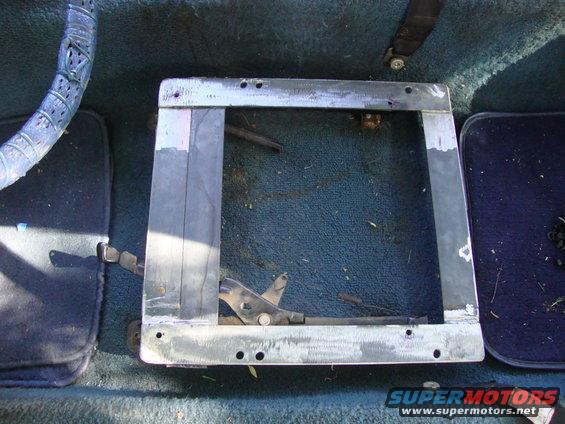 Interior seat mounting bracket with visible adjustment lever