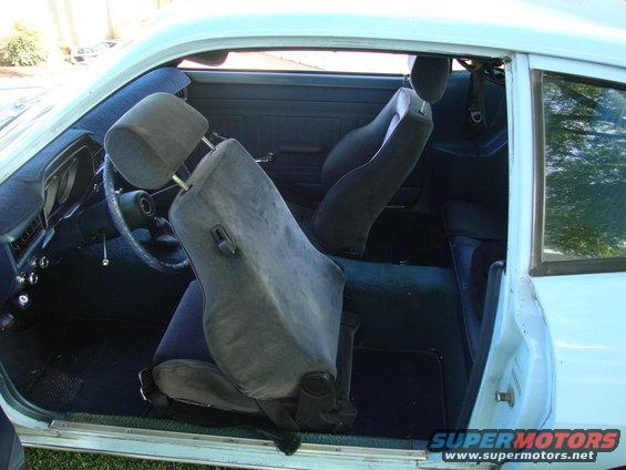 Light blue 1972 Ford Pinto interior with dark blue seats and dashboard