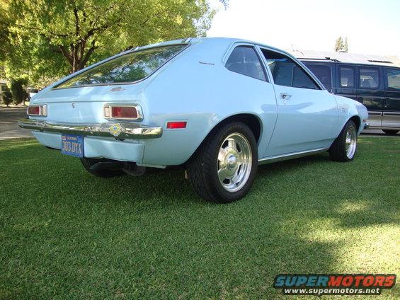 Light blue 1972 Ford Pinto hatchback with chrome wheels and a California license plate