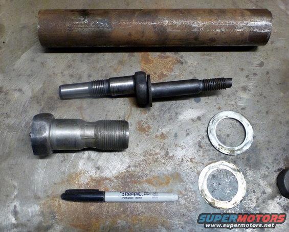 Suspension parts and a Sharpie marker on a metal surface