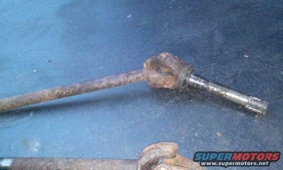 rusted drive shaft with u-joint and splined end