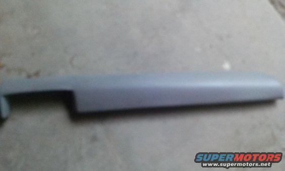 gray plastic trim piece, likely for a car door