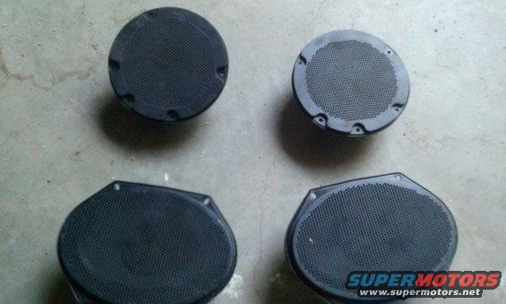 Four car speakers, two round and two oval