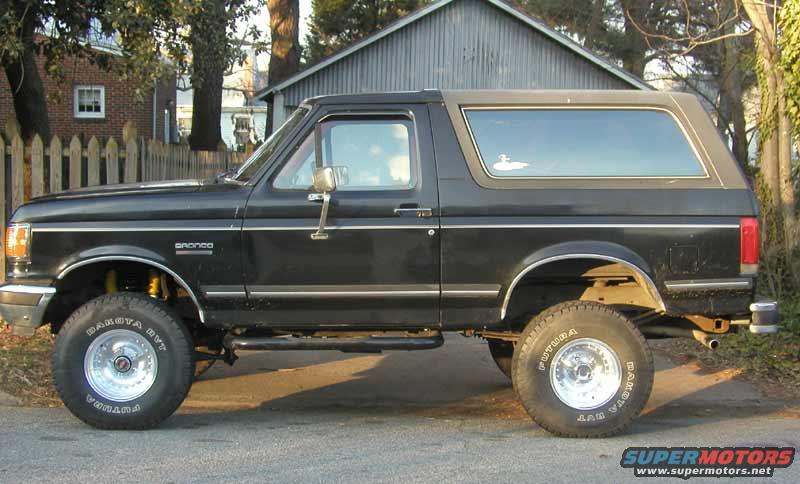 Side view of black 1988 Ford Bronco with aftermarket wheels