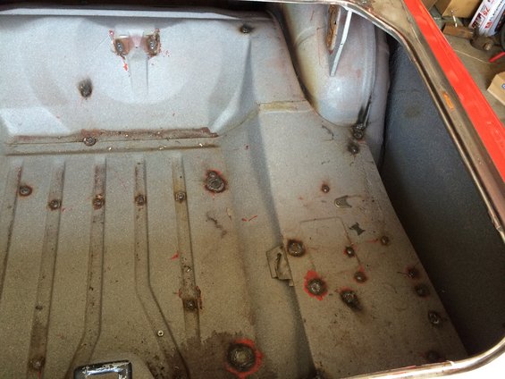 Trunk interior with visible welds and red paint markings