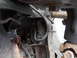 1992 Ford Bronco - Undercarriage view of a 1992 Ford Bronco, highlighting suspension and brake system parts.