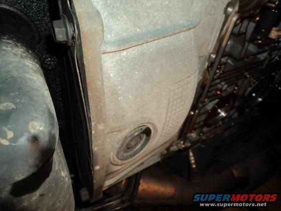 Underside view of vehicle transmission and exhaust pipe