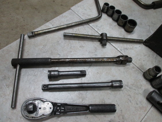 Socket wrench set with ratchet, T-handle, extensions, and sockets