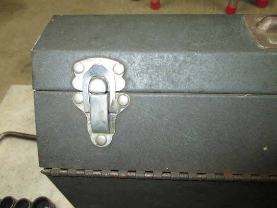 Metal toolbox latch and hinge detail
