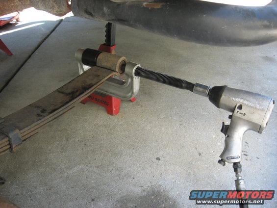 Leaf spring bushing removal with C-clamp tool and impact wrench